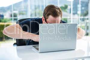 Handsome man using laptop