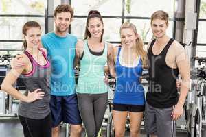 Athletic men and women posing together