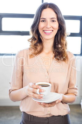Businesswoman having a cup of tea