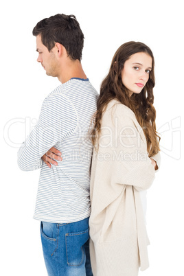 Couple standing back to back