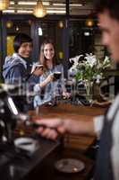 Smiling women having coffee