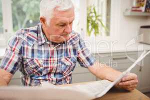 Senior man reading a newspaper