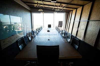 An empty modern conference room and conference table in office