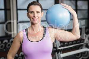 Pregnant woman holding exercise ball