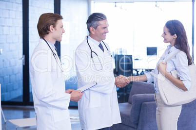 Doctor shaking hands with colleague