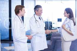 Doctor shaking hands with colleague