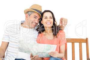 Couple on bench looking at map
