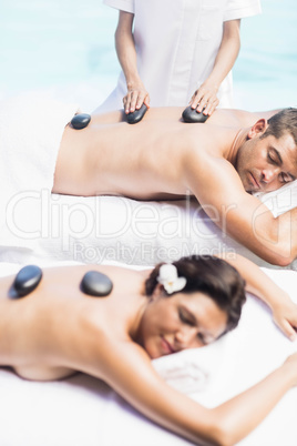 Couple getting a hot stone massage