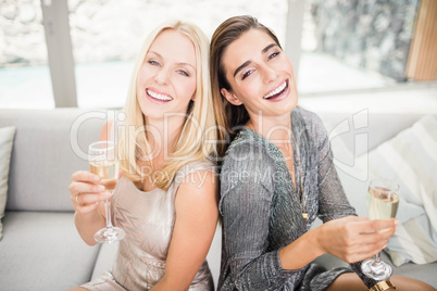 Portrait of beautiful women having champagne flute