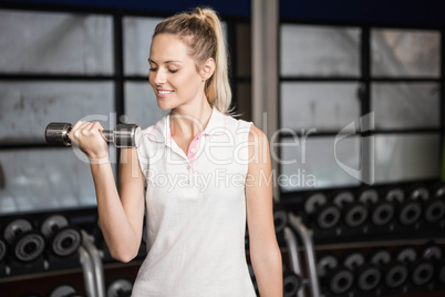 Woman exercising with dumbbells