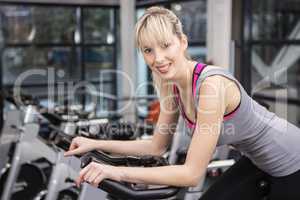 Fit woman on exercise bike