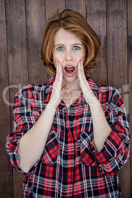 shocked hipster woman looking into the camera