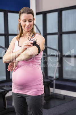 Pregnant woman listening to music