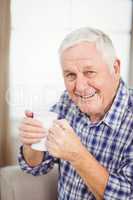 Senior man having a cup of coffee