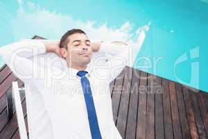 Smarty dressed man relaxing on sun lounger