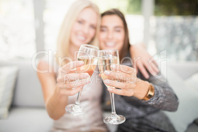 Beautiful women toasting champagne flute