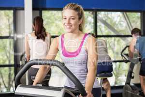 Fit woman doing exercise bike