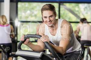 Fit man doing exercise bike