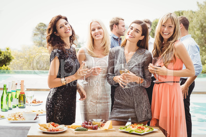 Happy young friends having drinks