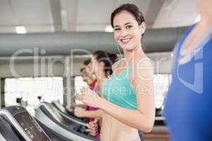 Fit woman running on treadmill