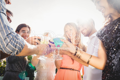 Happy young friends having drinks