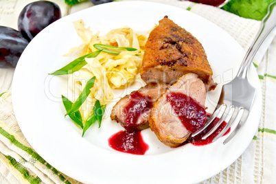 Duck breast whole cabbage and green onions in plate