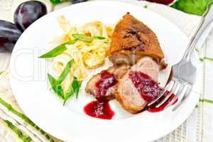 Duck breast whole cabbage and green onions in plate