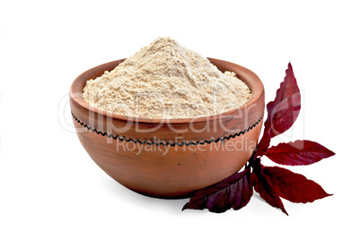 Flour amaranth in clay bowl with purple flower