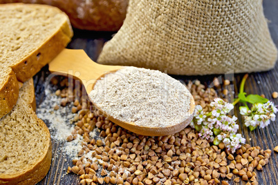 Flour buckwheat in spoon with cereals and flower on board