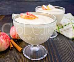 Jelly airy apple in glass bowl with cinnamon on board