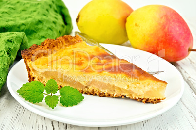 Pie pear with sour cream on light board