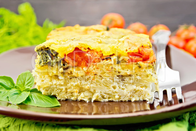Pie potato with tomato and cheese on board