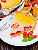 Pie strawberry with sour cream on dark board