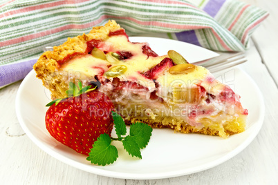 Pie strawberry-rhubarb with sour cream and berries on board