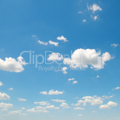 white cumulus clouds against the blue sky