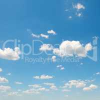 white cumulus clouds against the blue sky