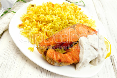 Salmon with rice on light board