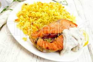 Salmon with rice on light board