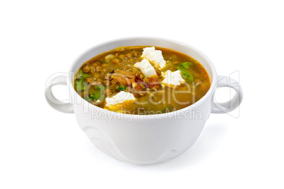 Soup lentil with spinach and cheese in white bowl