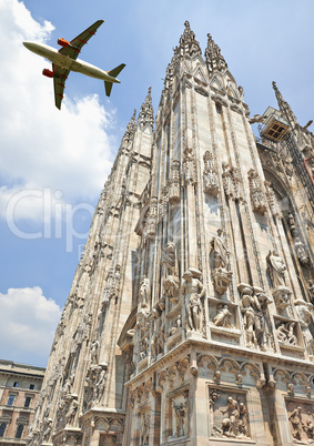 A jet plane flying low over the Milan Cathedral