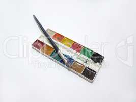 a set of watercolor paints and brush