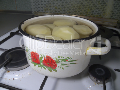 pan of potatoes on the gas stove