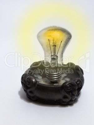 incandescent lamp, mounted in a candlestick instead of candle