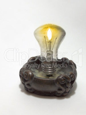 incandescent lamp, mounted in a candlestick instead of candle