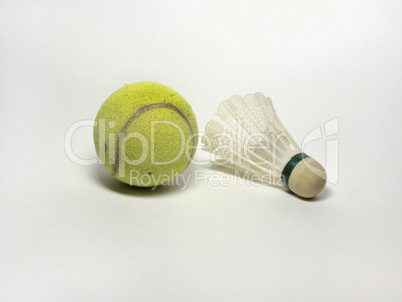 tennis ball and badminton shuttlecock on white