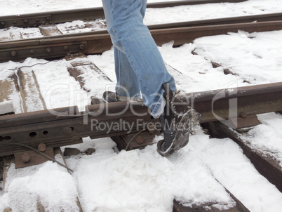 step over the rails, walk on the sleepers
