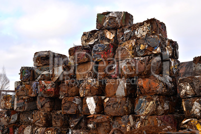A pile of compressed cars in blocks for processing