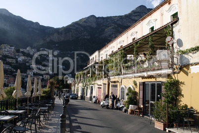 promenade, parking and rocky coastline on the background in Sorrento.