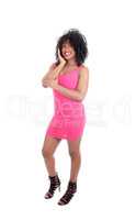 African American woman standing in pink dress.