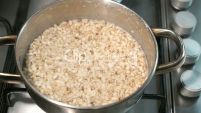 Barley porridge cooked in the pan